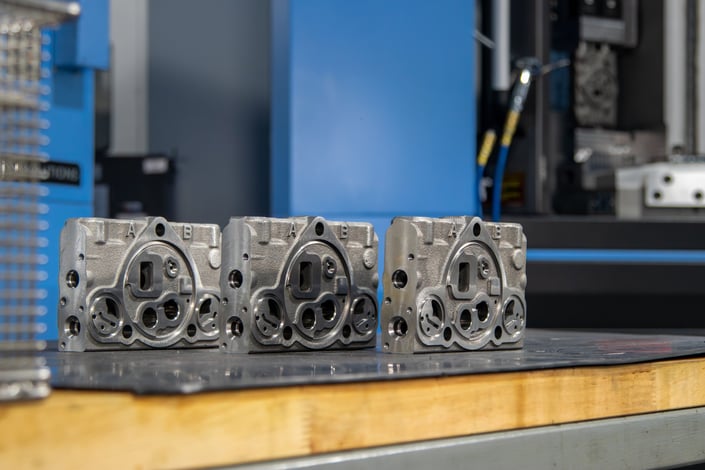 3 spool housings on a desk.